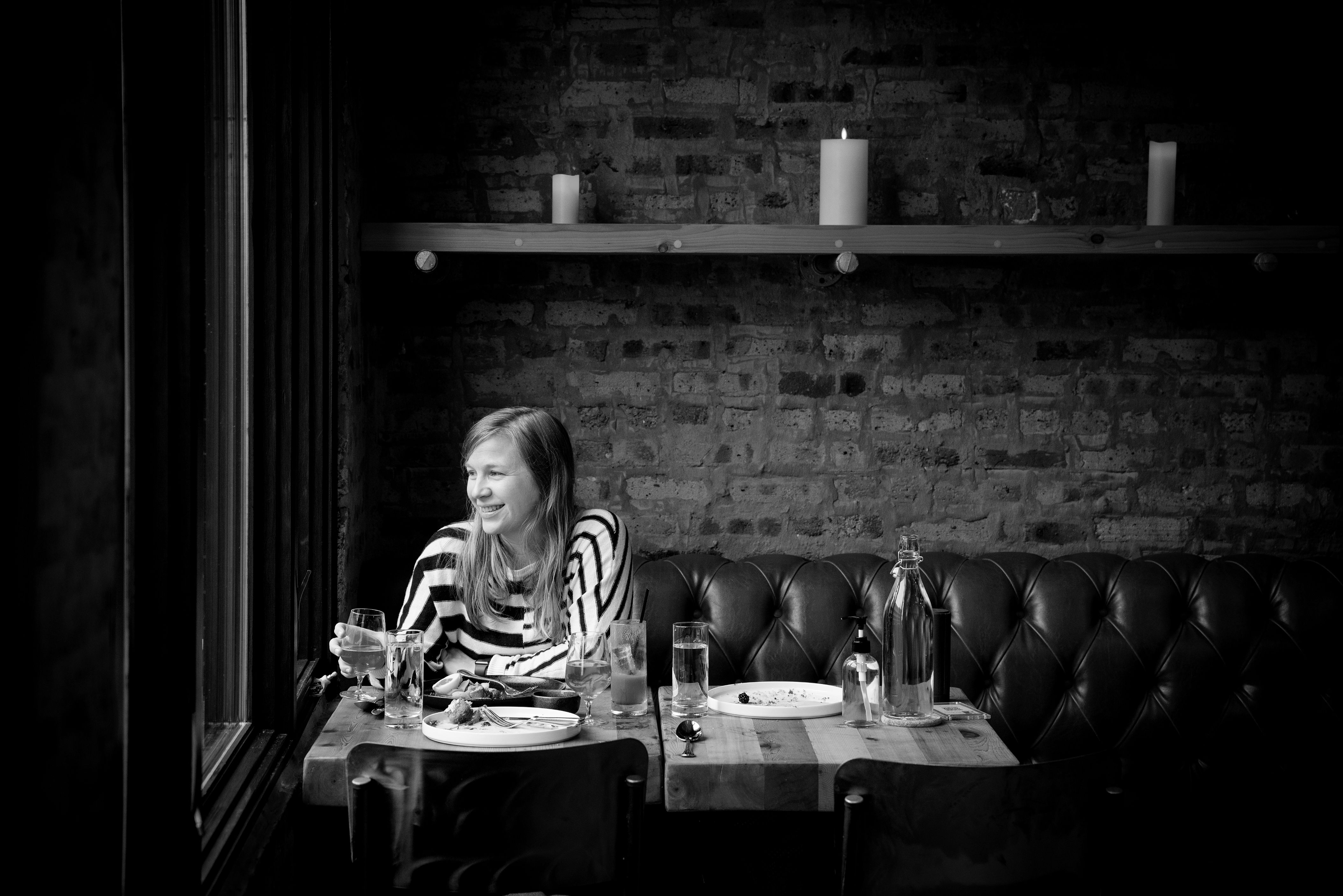 Black and White photo of women in restaurant booth in Bucktown Chicago