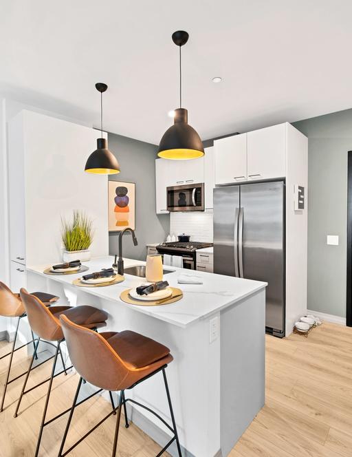 A luxury apartment’s kitchen in the Triangle Square Apartments.